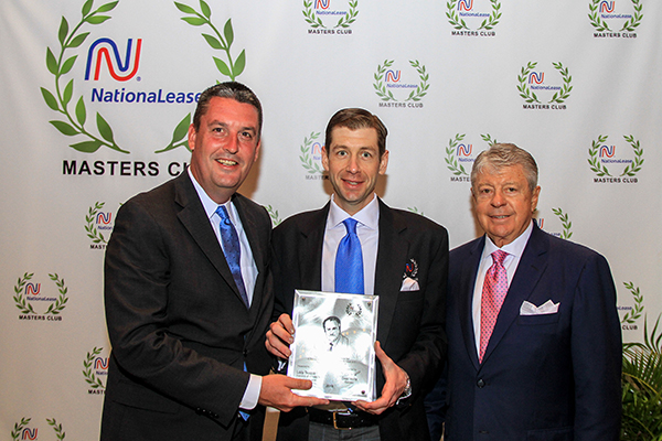 Dean Vicha (left), President of NationaLease, presented the coveted Gene Scoggins Sales Award to Salem NationaLease’s Lacy Teague (center), standing with Thomas Teague.